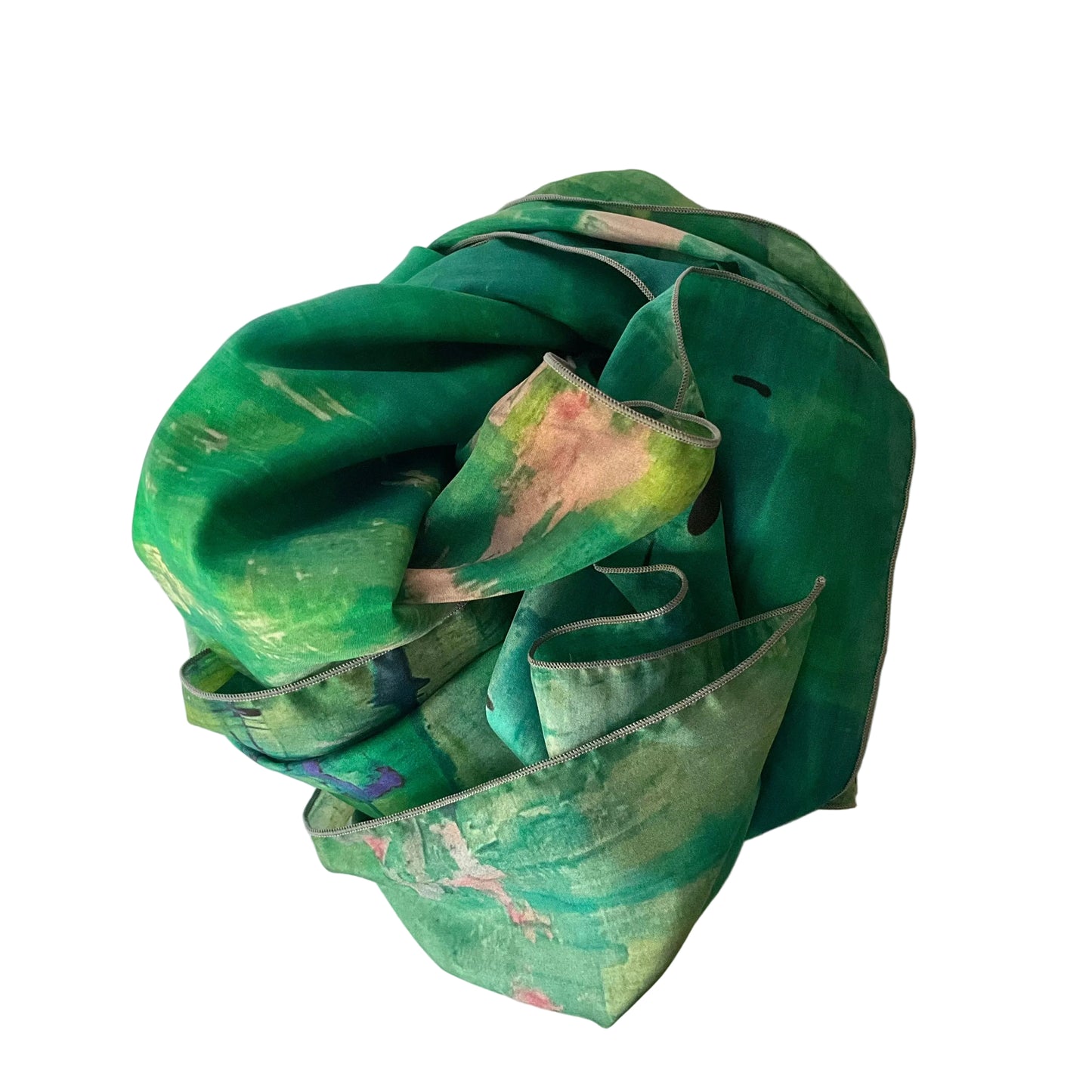 Green fabric with colorful patterns on a white background